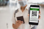 Traveler,Shows,Health,Passport,Of,Vaccination,Certification,On,Phone,At